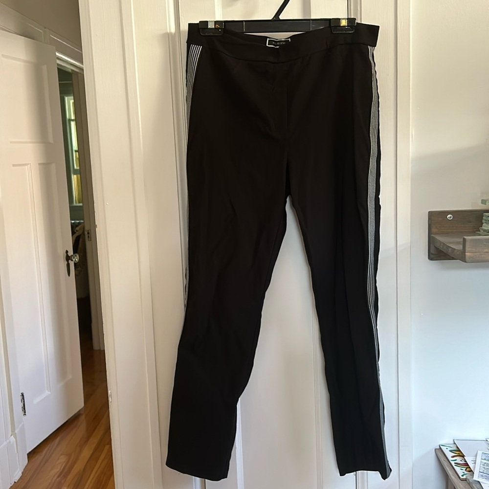 Black slim pants with striped banding on the legs